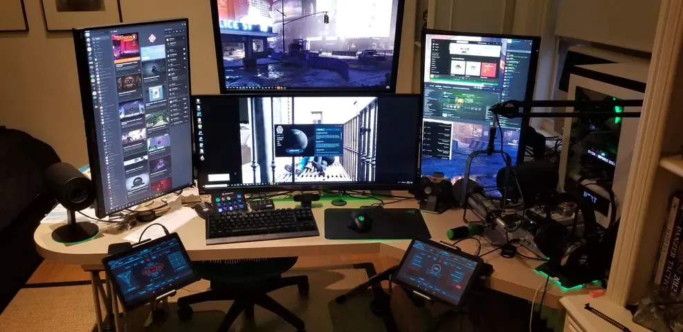A player's desk setup running GameGlass panels on a tablet