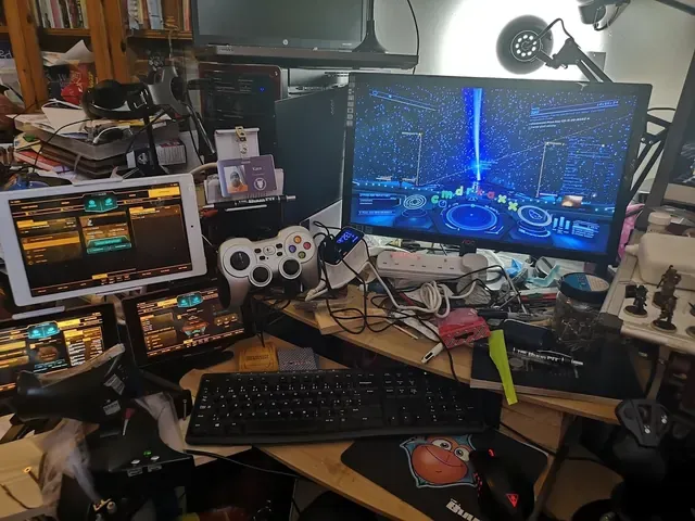 A player's desk setup running GameGlass panels on a tablet