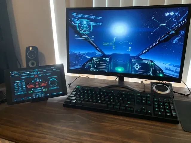 A player's desk setup running GameGlass panels on a tablet