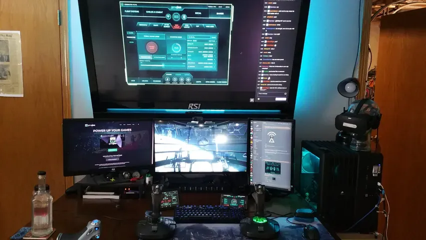 A player's desk setup running GameGlass panels on a tablet