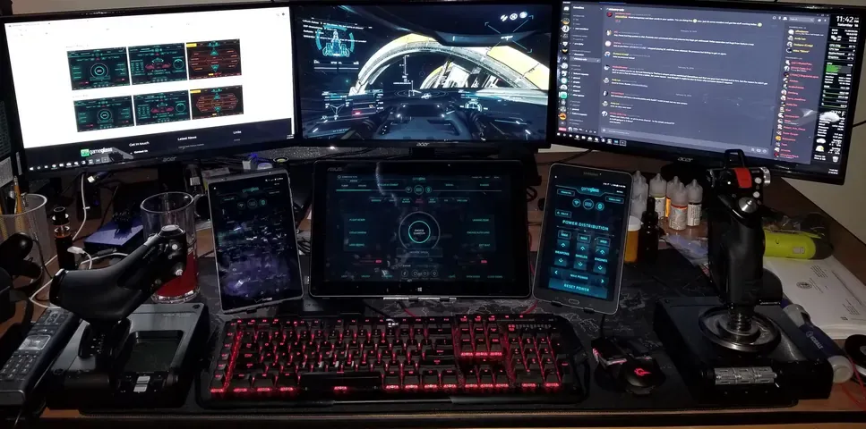 A player's desk setup running GameGlass panels on a tablet