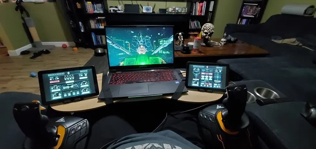 A player's desk setup running GameGlass panels on a tablet
