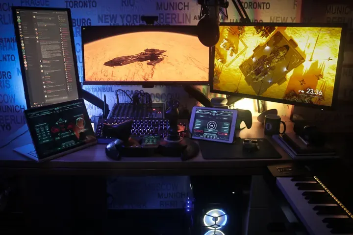 A player's desk setup running GameGlass panels on a tablet