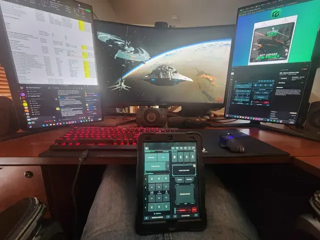 A player's desk setup running GameGlass panels on a tablet