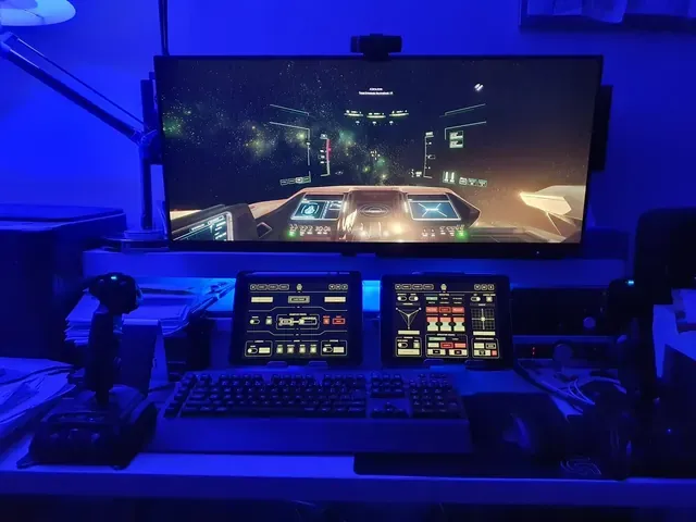 A player's desk setup running GameGlass panels on a tablet