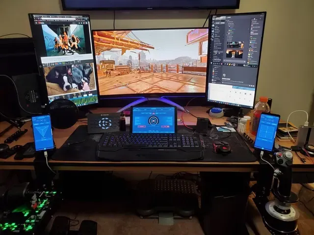 A player's desk setup running GameGlass panels on a tablet