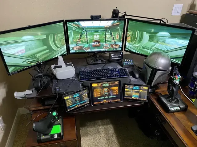A player's desk setup running GameGlass panels on a tablet