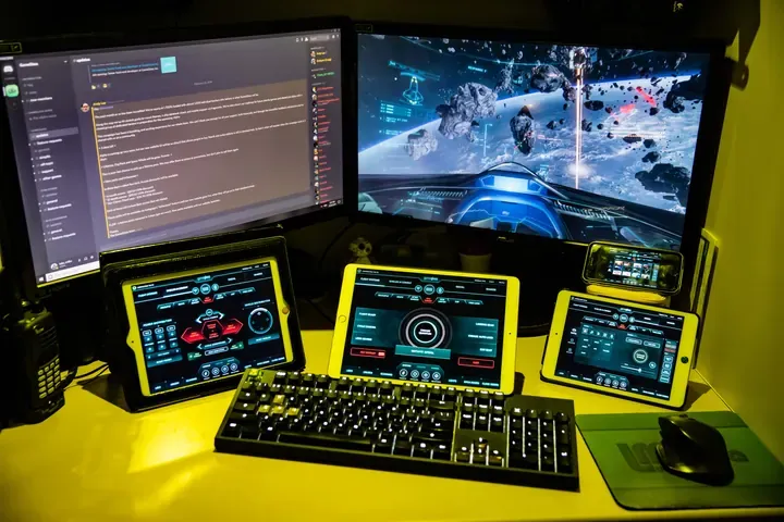 A player's desk setup running GameGlass panels on a tablet