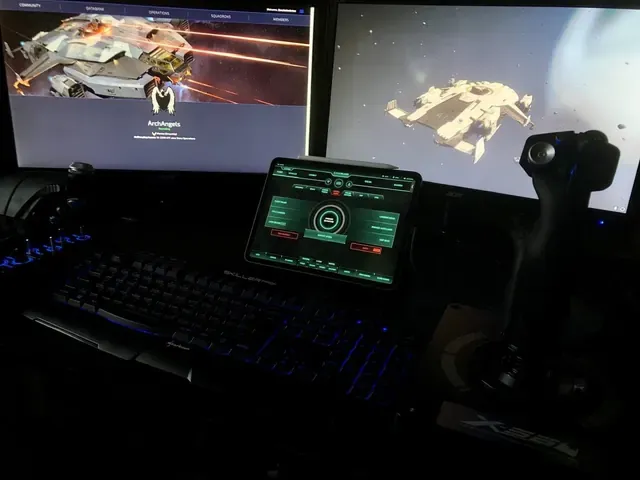 A player's desk setup running GameGlass panels on a tablet
