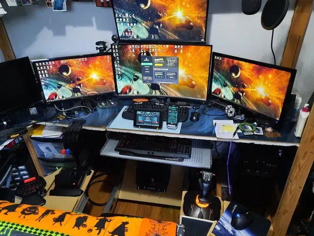 A player's desk setup running GameGlass panels on a tablet