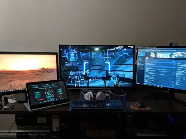 A player's desk setup running GameGlass panels on a tablet