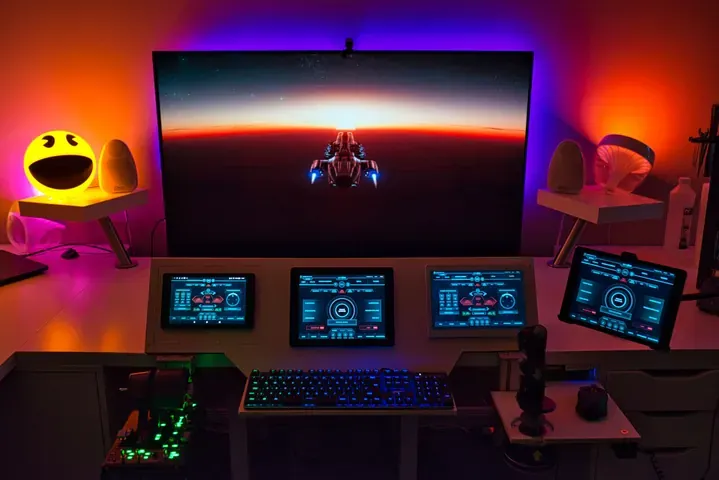 A player's desk setup running GameGlass panels on a tablet